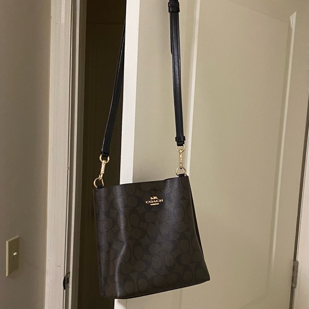 Coach crossbody bag. Excellent condition reattached button (See picture)